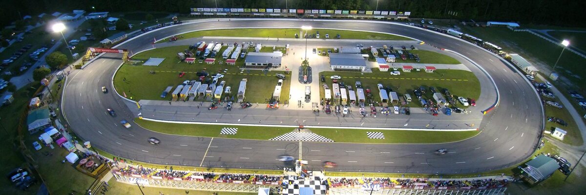 Stock cars racing under the lights at Carteret County Speedway